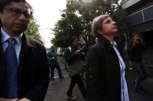Mexican journalist Carmen Aristegui walks after speaking with journalists outside MVS radio station in Mexico City March 16, 2015.