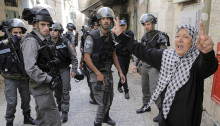 Israeli police block a Palestinian woman's access to the Haram al-Sharif/Temple Mount (Photo Credit Al-Monitor/Reuters-Ammar Awad)