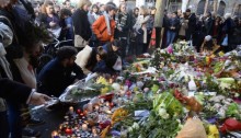 Mourners gather at a makeshift memorial to victims of the November 2015 attacks in Paris [Photo Credit: AFP/BBC]