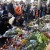 Mourners gather at a makeshift memorial to victims of the November 2015 attacks in Paris [Photo Credit: AFP/BBC]